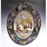 A Victorian lead lined stained glass oval panel, depicting a galleon to the centre, 38.5 x 30.5cm.