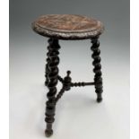 A carved oak stool, 19th century, with barley twist legs joined by bobbin turned stretchers,