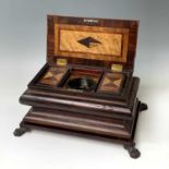 A Regency sarcophagus tea caddy of multiple specimen woods, the hinged lid revealing a central green