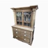 A Victorian pine kitchen cabinet, the pair of glazed doors enclosing three shelves, the lower part