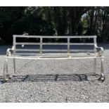 A 19th century wrought iron garden bench, painted white, with scroll end arms and supports. Width