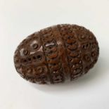 A 19th Century carved coquilla nut pomander, length 7.5cm. Provenance:Michael Trethewey. A Gentleman