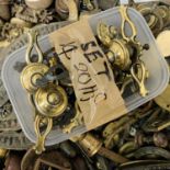 A collection of miscellaneous antique and later brass handles, locks, backplates, casters etc.