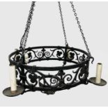 A substantial Arts and Crafts Gothic style wrought iron electrolier, fitted four sconce style lamps,