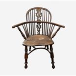 An elm and yew Windsor armchair, 19th century, with a low hoop back, pierced splat and spindle
