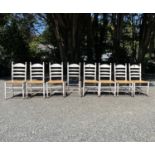 A set of eight white-painted rush seated ladderback dining chairs, 19th century. (one seat missing)