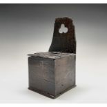 An oak salt box, 17th century, with a hinged lid and inscribed 'ALMF' to the front, height 34cm,