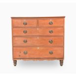 A George III pine chest of drawers, with two short and three long graduated drawers, on turned feet,