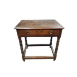 An elm and oak side table, part 17th century, with a single frieze drawer on turned legs, joined
