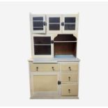 A 20th century painted pine kitchen cabinet, with four glazed cupboard doors. the lower part with an