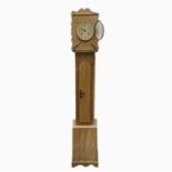 A pine grandmother clock, height 162cm, width 25cm.