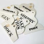 Eight 19th century creamware wine bin labels for Port, Whisky, Sherry, Gin, Hock, Take This, Madeira