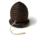 A 19th century treen string box, in the form of a beehive, raised on small bun feet, height 8cm,