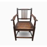 A George III oak open armchair, with a vertical bar splat above a solid seat, on square tapering