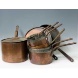 A late Victorian copper saucepan, initialled J.W.G.S to the lid, with iron handle, height 21cm,