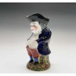 A Staffordshire pottery Toby jug, late 19th century, standing with his hands in his waistcoat