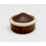 An early 19th century treen and ivory pill box, height 2.5cm, diameter 4.5cm. Provenance:Michael