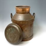 A Torridge Vale Torrington copper milk churn, the cover inscribed 'North Western Dairies, Dorset',