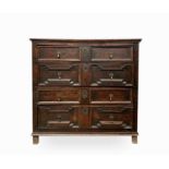 A Jacobean oak chest of drawers, with four long drawers on stile feet, height 86cm, width 90.5cm,