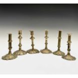 Six George III petal base brass candlesticks, height of tallest 20cm. Provenance:Michael