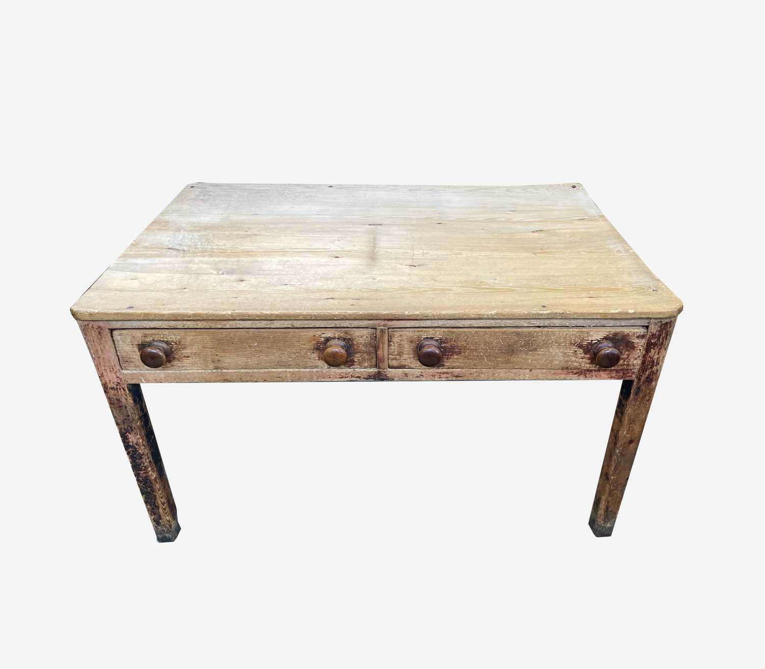 A Victorian pine kitchen table, the rectangular top with rounded corners, on partly turned square