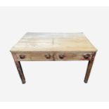 A Victorian pine kitchen table, the rectangular top with rounded corners, on partly turned square