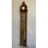 A Victorian Admiral Fitzroy wall barometer, fitted with thermometer, the carved oak case with an