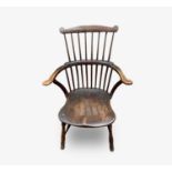An ash and elm 'comb back' Windsor armchair, 19th century, height 94cm, width 60cm.Condition report: