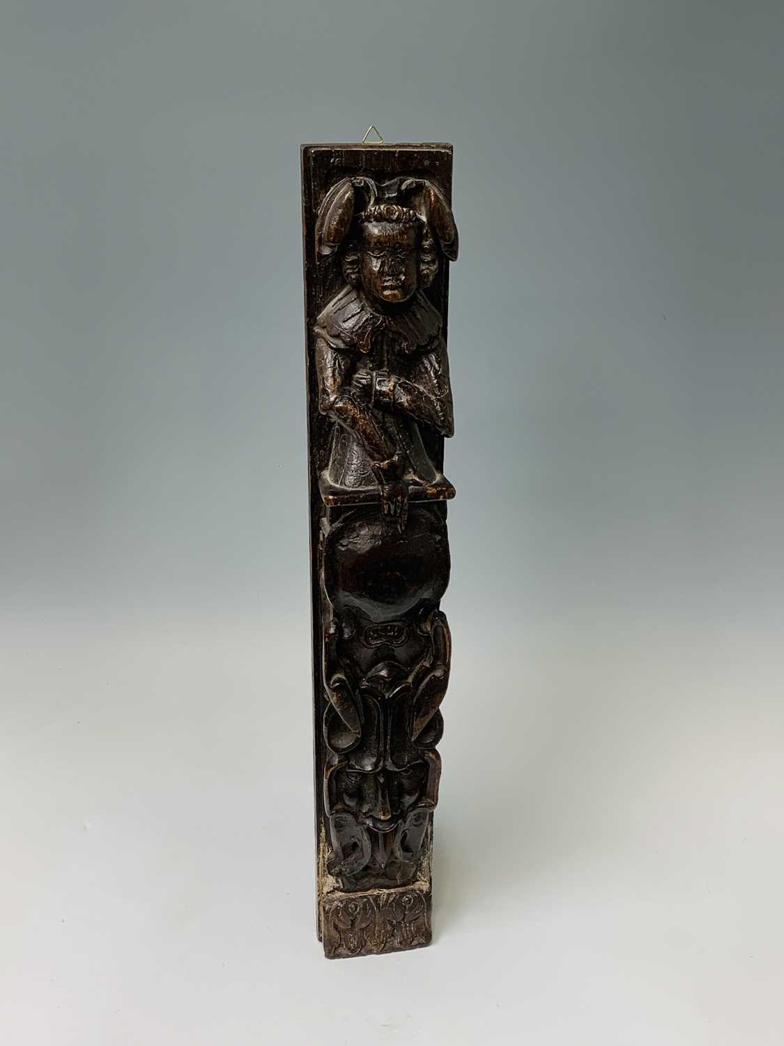 An oak carved oak term panel, 16th century, depicting a male figure rising above a vacant - Image 2 of 10