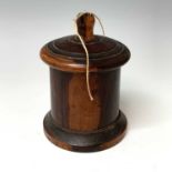 A Victorian lignum vitae string box, of cylindrical form with screw fitting domed lid, height 15.