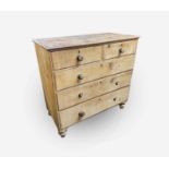 A Victorian pine chest of drawers, with two short and three long graduated drawers, on turned