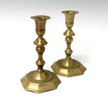 A pair of 18th century brass candlesticks, height 17.5cm, width 9.7cm.