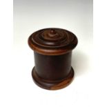 A Victorian lignum vitae string box, of cylindrical form with screw fitting domed lid, height 12.