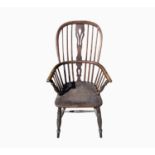 An ash and elm Windsor armchair, 19th century, the central pierced splat and spindle filled back