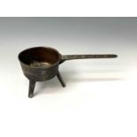 An 18th century bronze skillet, the handle cast Warner, height 10.5cm, width 37cm, diameter 15.