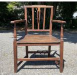 A George III oak open armchair.