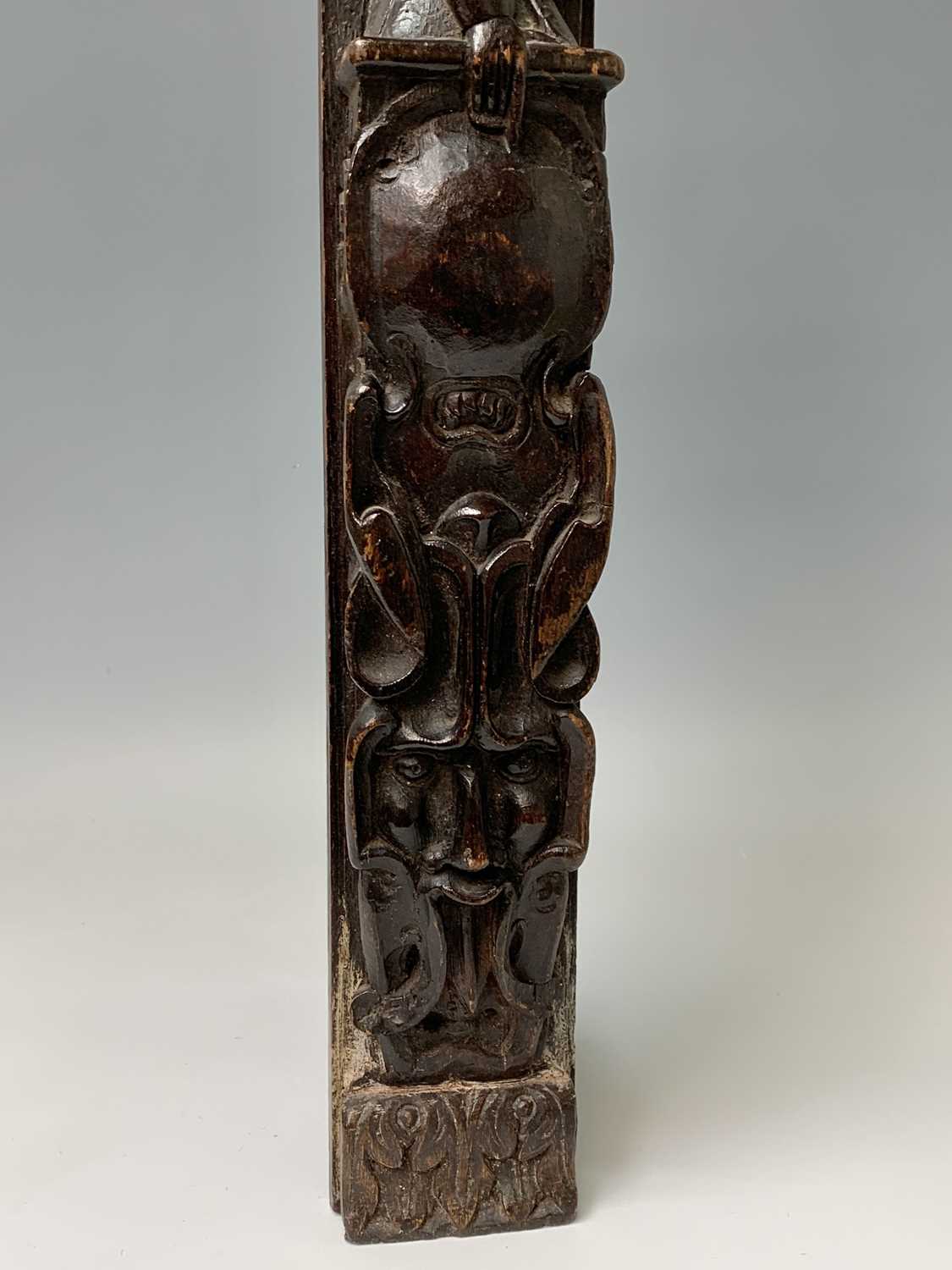 An oak carved oak term panel, 16th century, depicting a male figure rising above a vacant - Image 8 of 10