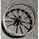 An old cartwheel, bearing traces of green paint. Diameter 98cm.