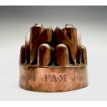 A Victorian copper jelly mould, initialled F.A.M, height 11.5cm, diameter 13.5cm. Provenance:Michael