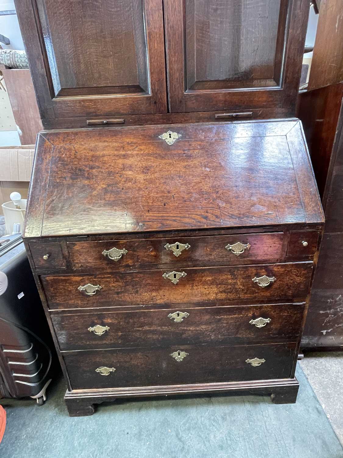 A George III oak bureau bookcase, with a pair of arched panelled doors opening to reveal shelves and - Image 2 of 6