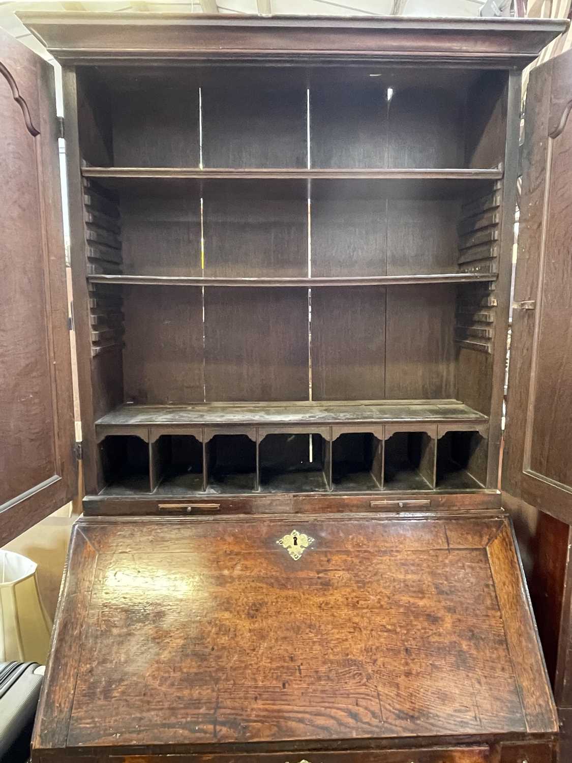 A George III oak bureau bookcase, with a pair of arched panelled doors opening to reveal shelves and - Image 3 of 6