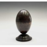 A 19th century lignum vitae egg-shaped string box, on circular base, height 14cm, diameter of base