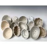 A selection of fifteen white ceramic jelly moulds. Provenance:Michael Trethewey. A Gentleman of