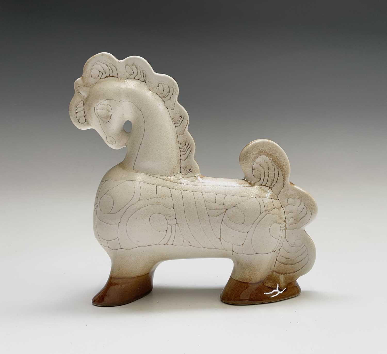 A cream Newlyn Pottery horse in Medallion pattern, height 24.5cm.Condition report: Repair to tail