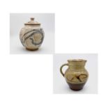 A Winchcombe Pottery jug 16cm and a studio stoneware lidded jar 18.5cm