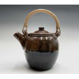 Trevor CORSER (1938-2015) A tenmoku glaze teapot with swing bamboo handle Impressed makers marks