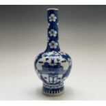 A Chinese porcelain blue and white vase, Kangxi six character mark, each cartouche filled with a