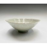 ??A Chinese Qingbai ware pale celadon tapering conical bowl, Song Dynasty, the interior with foliate