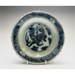 A Chinese blue and white dish, Ming Dynasty, depicting a Qilin to the centre and character marks