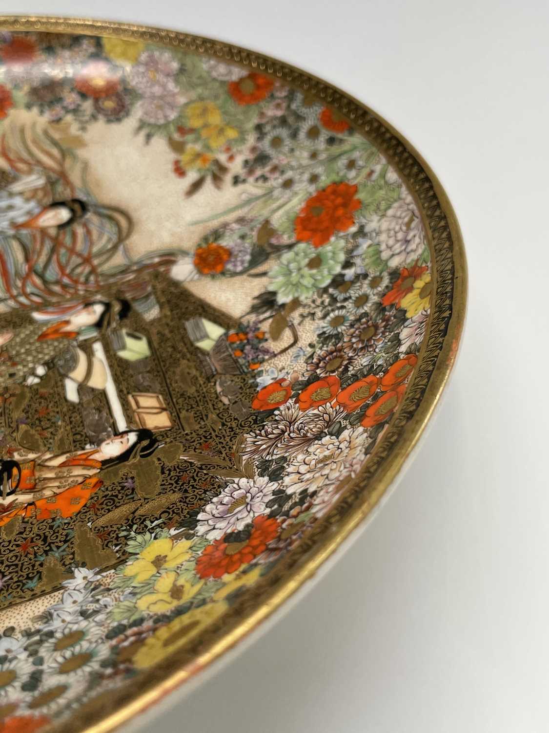 A Japanese Satsuma plate by Ryuzan, Meiji Period, gilt decorated with geisha in a garden setting, - Image 2 of 16